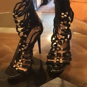 Black and gold Bebe stilettos